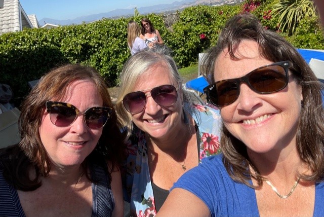 three women smiling 